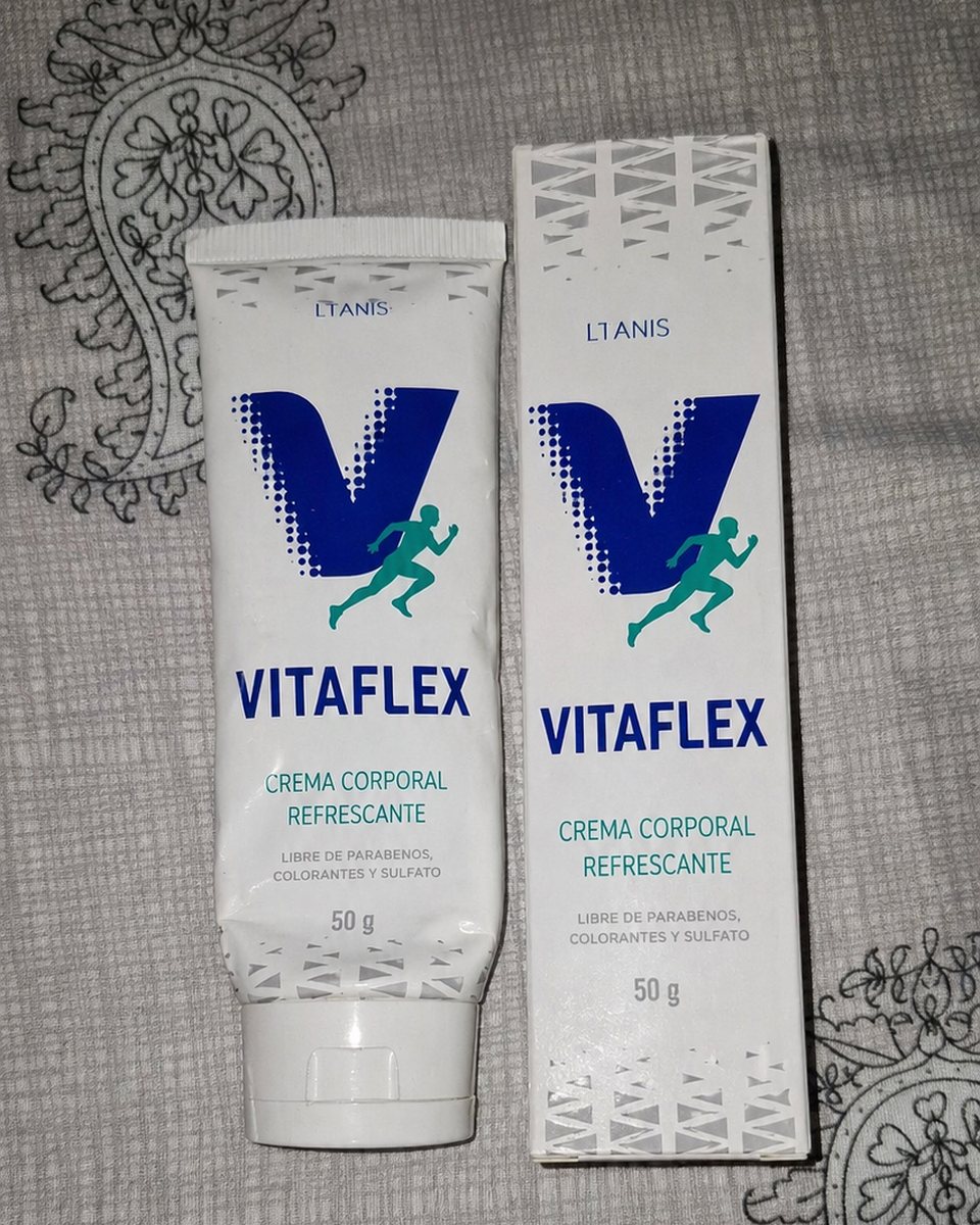 Tubo y caja de Vitaflex sobre una tela